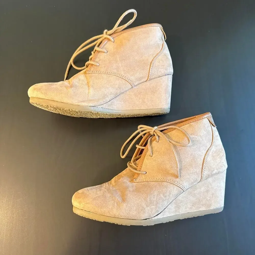 Tan suede ankle boots with lace-up design and chunky sole